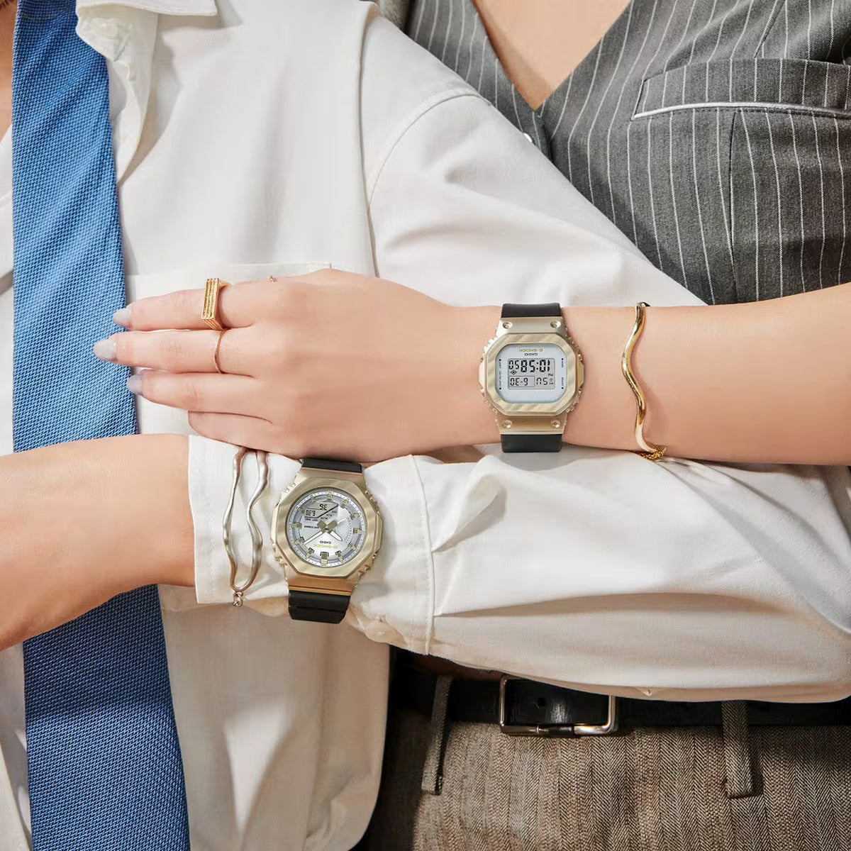 Casio G-Shock GM-S5600BC-1 women’s digital watch with a gold-tone square bezel, light digital display, and black strap worn on the wrist in a coordinated lifestyle look.