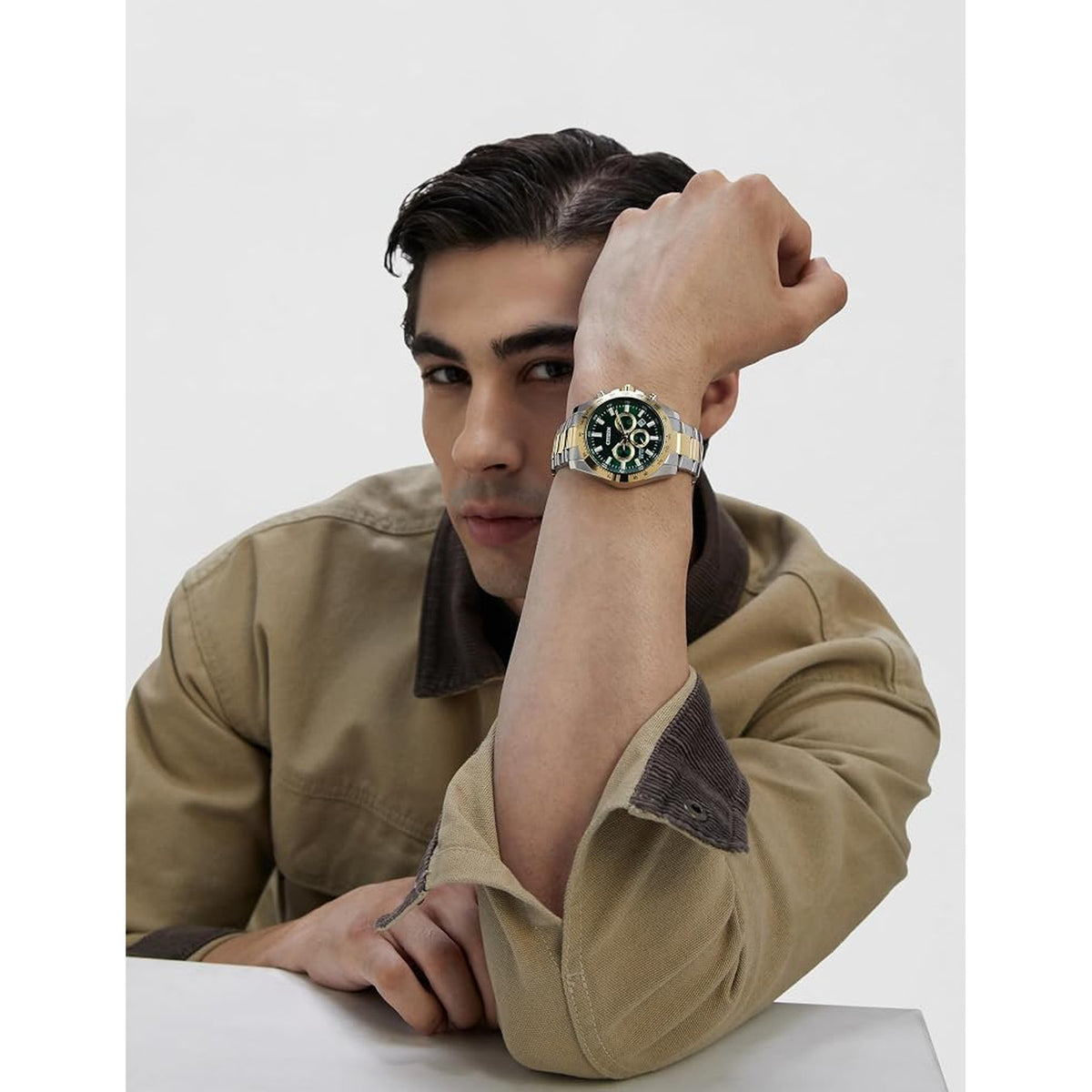 Citizen Sports Chronograph AN8234-58X with a green chronograph dial, gold-tone accents, and a silver and gold-tone stainless steel bracelet worn on the wrist.