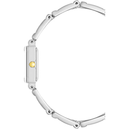 Vista lateral del reloj Anne Klein 10/4899SVTT, caja rectangular plateada con corona dorada y brazalete metálico fino