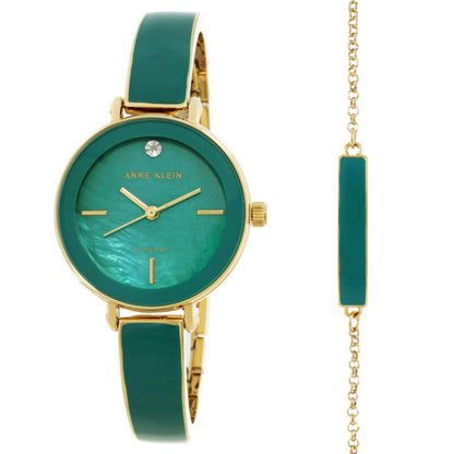 Anne Klein AK/3620GNST watch and bracelet set with green mother-of-pearl dial, gold-tone case, green enamel bracelet, crystal marker, side crown, and matching green accent bracelet.
