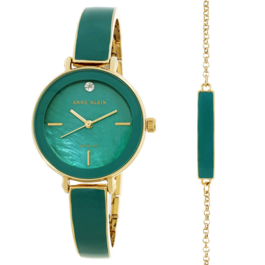 Anne Klein AK/3620GNST watch and bracelet set with green mother-of-pearl dial, gold-tone case, green enamel bracelet, crystal marker, side crown, and matching green accent bracelet.
