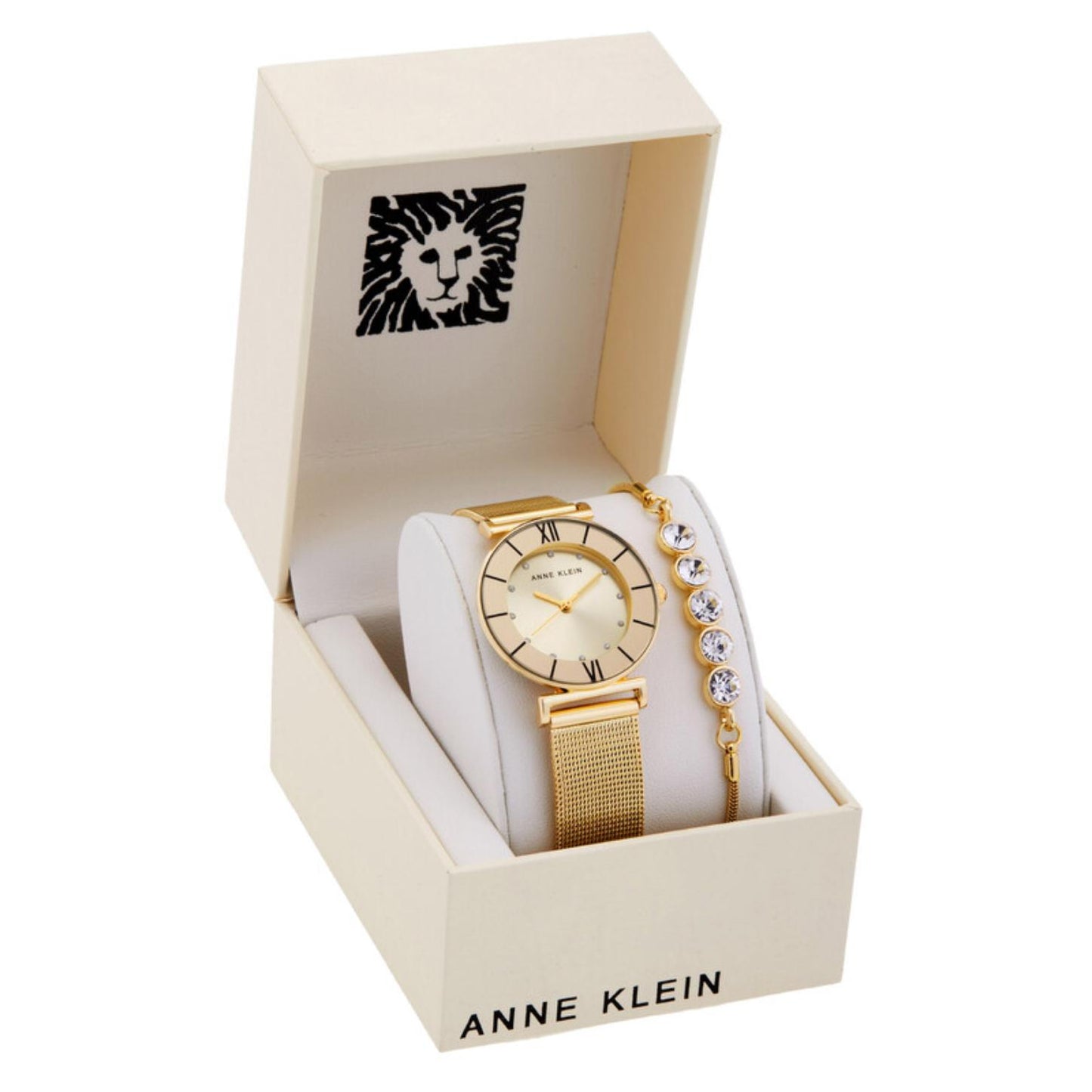 Anne Klein AK-3780CHGBST gift set with gold-tone watch, matching crystal accent bracelet, white display cushion, and open Anne Klein presentation box.
