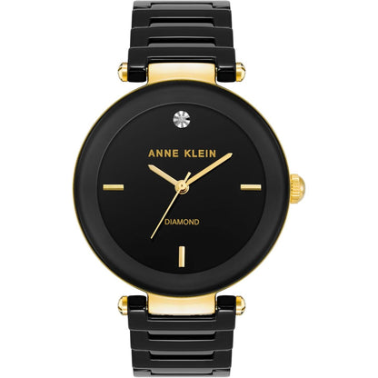 Reloj Anne Klein AK/1018BKBK vista frontal, esfera negra con diamante y brazalete negro con detalles dorados
