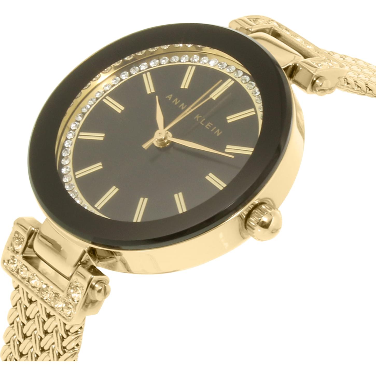 Anne Klein AK/1906BKGB with black dial, crystal-accented inner bezel, gold-tone hands and markers, and polished gold-tone case with mesh bracelet.