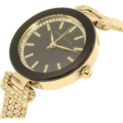 Anne Klein AK/1906BKGB with black dial, crystal-accented inner bezel, gold-tone hands and markers, and polished gold-tone case with mesh bracelet.