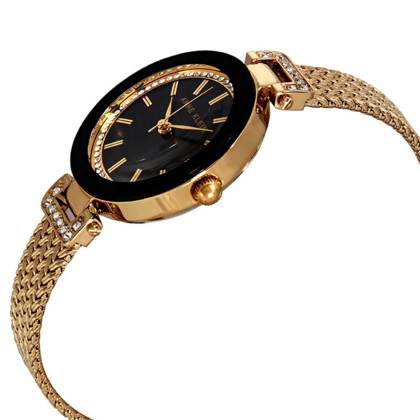 Anne Klein AK/1906BKGB with black dial, crystal-accented bezel, gold-tone case profile, and woven mesh bracelet with polished crystal details.