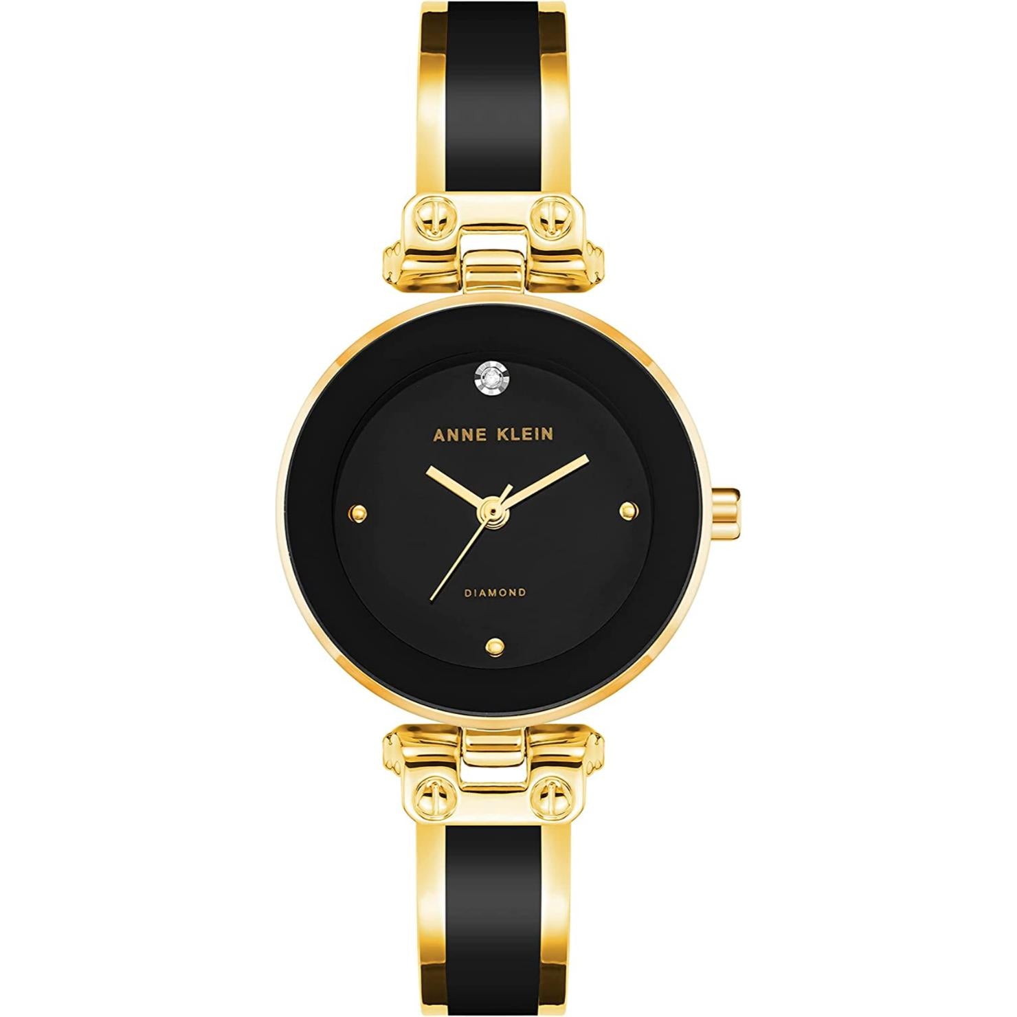 Reloj Anne Klein AK/1980BKGB vista frontal, esfera negra con diamante y brazalete negro con detalles dorados
