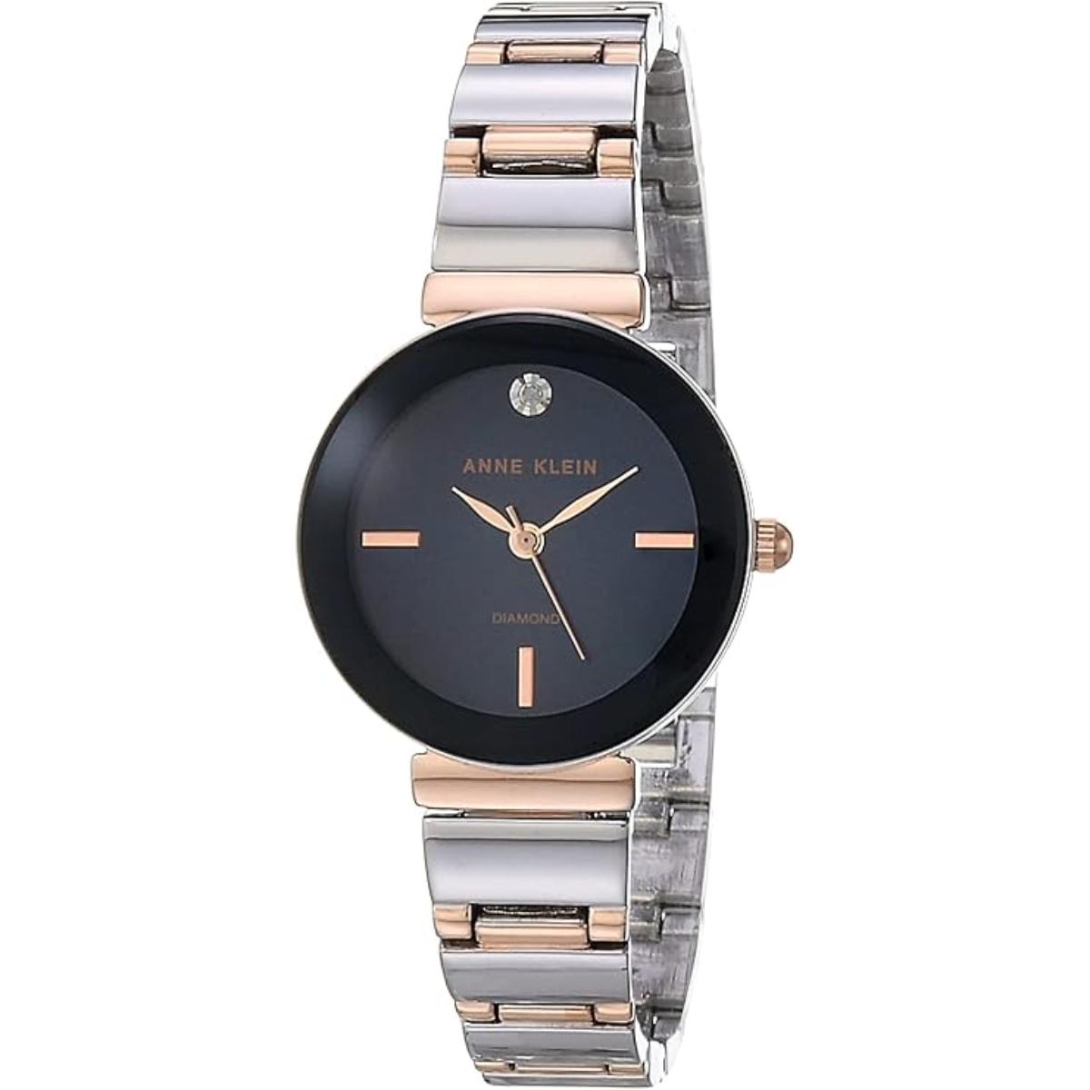 Anne Klein AK/2435NVRT with dark blue dial, single diamond accent marker, rose gold-tone hands, and two-tone stainless steel bracelet.