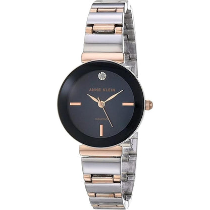 Anne Klein AK/2435NVRT with dark blue dial, single diamond accent marker, rose gold-tone hands, and two-tone stainless steel bracelet.
