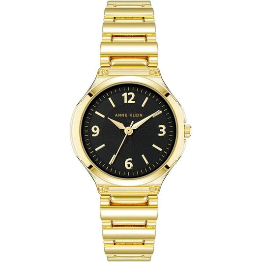 Anne Klein AK/3812BKGB with black textured dial, gold-tone hands and numeral markers, and polished gold-tone bracelet with decorative accents.