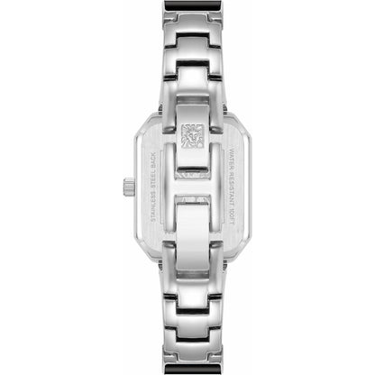 Anne Klein AK/4163BKSV with stainless steel rear case, engraved caseback details, and polished silver-tone bangle bracelet with jewelry clasp.