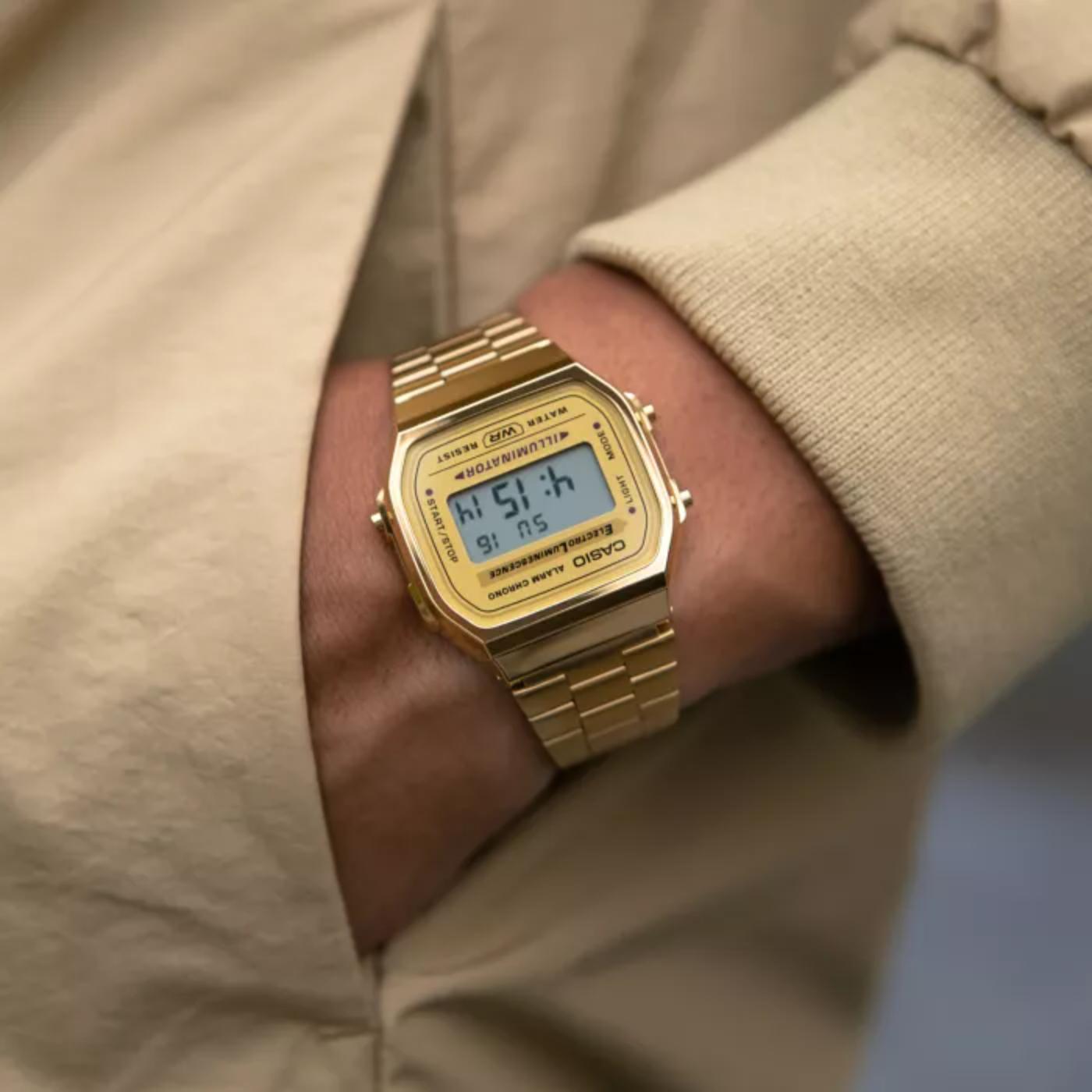 Casio A168WG-9UR vintage digital watch with gold tone case and stainless steel bracelet worn on wrist with retro style design