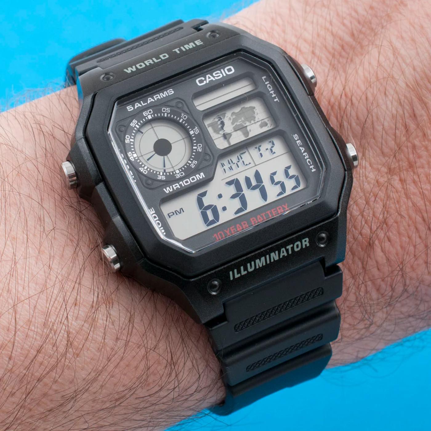 Casio AE-1200WH-1A digital world time watch with black resin case, multi display screen and map feature worn on wrist with durable sport design