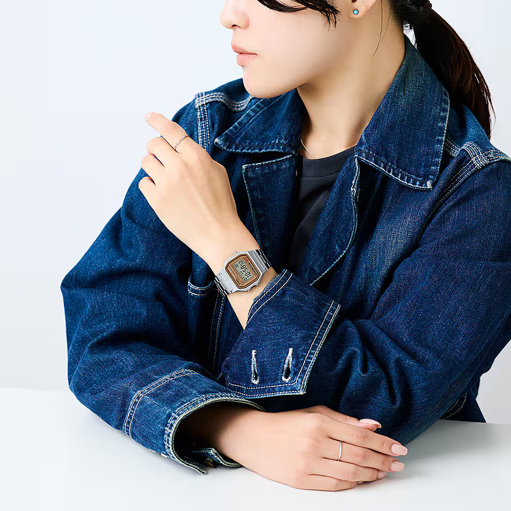Casio Digital Classic vintage watch worn on the wrist with digital display and stainless steel bracelet.