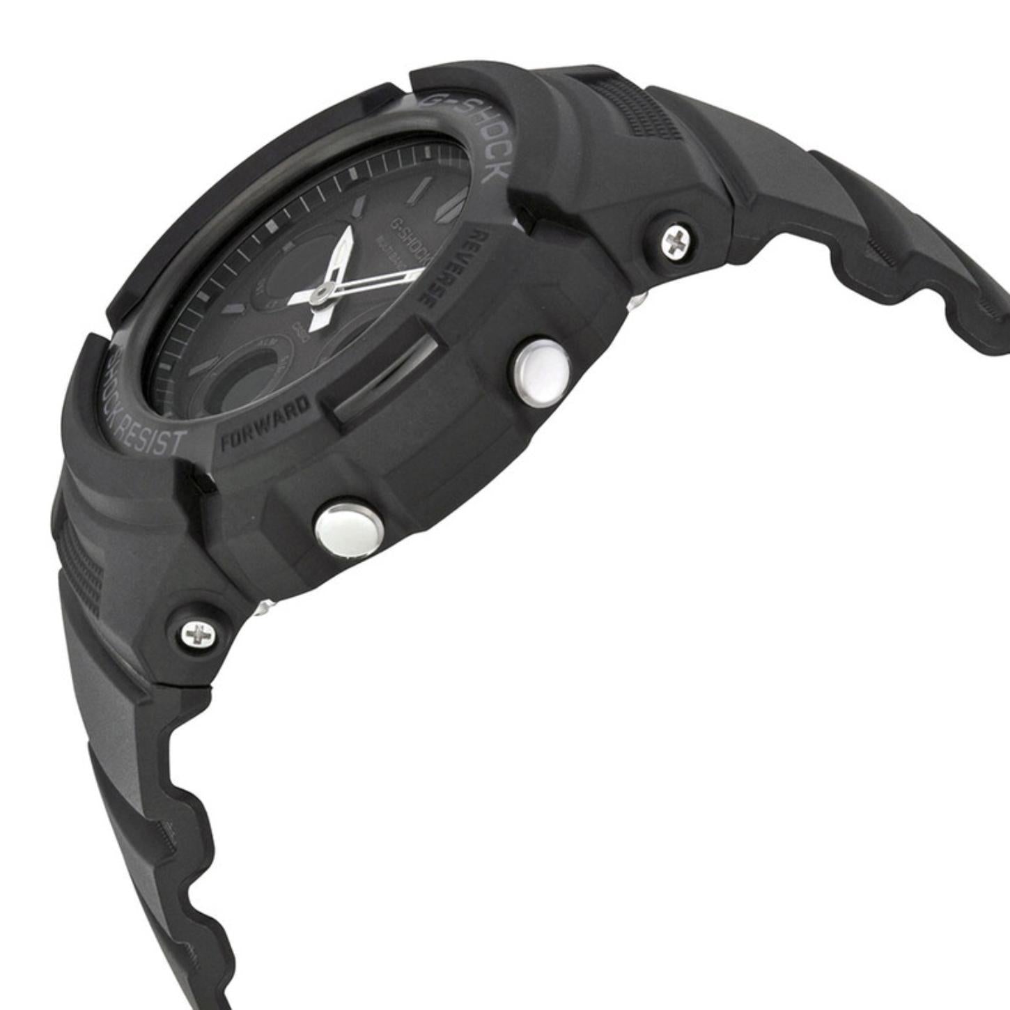 Casio G-Shock AWG-M100B-1A from the side with a rugged black resin case, raised protective bezel, silver-tone push buttons, exposed screws, and black resin band.