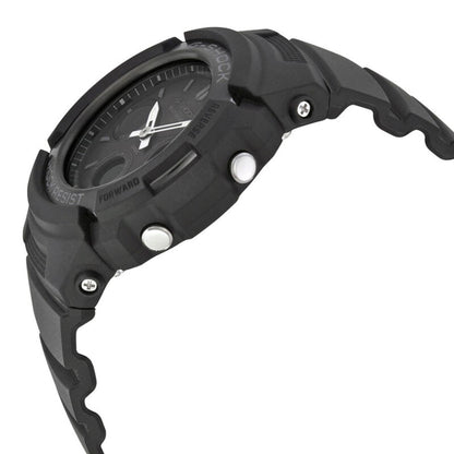 Casio G-Shock AWG-M100B-1A from the side with a rugged black resin case, raised protective bezel, silver-tone push buttons, exposed screws, and black resin band.