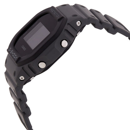 Casio G-Shock DW-5610UU-8DR men’s digital watch with a dark gray resin side profile, exposed metal push buttons, visible screws, and a matching gray resin strap.
