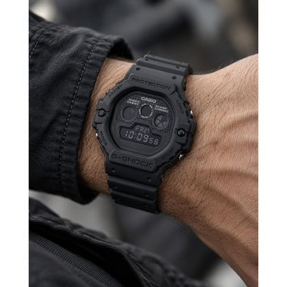 Casio G-Shock DW-5900UBB-1DR men's digital sport watch worn on wrist showcasing the all-black resin case and dark display