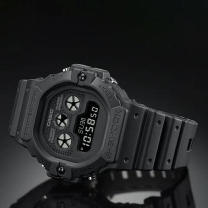 Casio G-Shock DW-5900UBB-1DR men's digital watch with matte black resin bezel, triple indicator eyes, and negative digital display