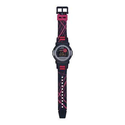 Casio G-Shock G-B001MVA-1DR men’s digital watch with a full-length black strap, red graphic accents, round black case, and negative digital display.