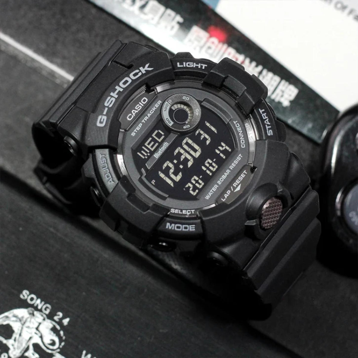 Casio G-Shock G-Squad GBD-800-1B men’s digital sport watch with a black case and strap, negative digital display, step tracker subdial, and metallic front button accent.