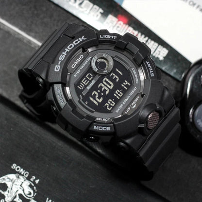 Casio G-Shock G-Squad GBD-800-1B men’s digital sport watch with a black case and strap, negative digital display, step tracker subdial, and metallic front button accent.
