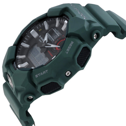 Casio G-Shock GA-010-2A with a black analog-digital dial, dark green resin case, raised protective guards, exposed screws, and textured black side accents.