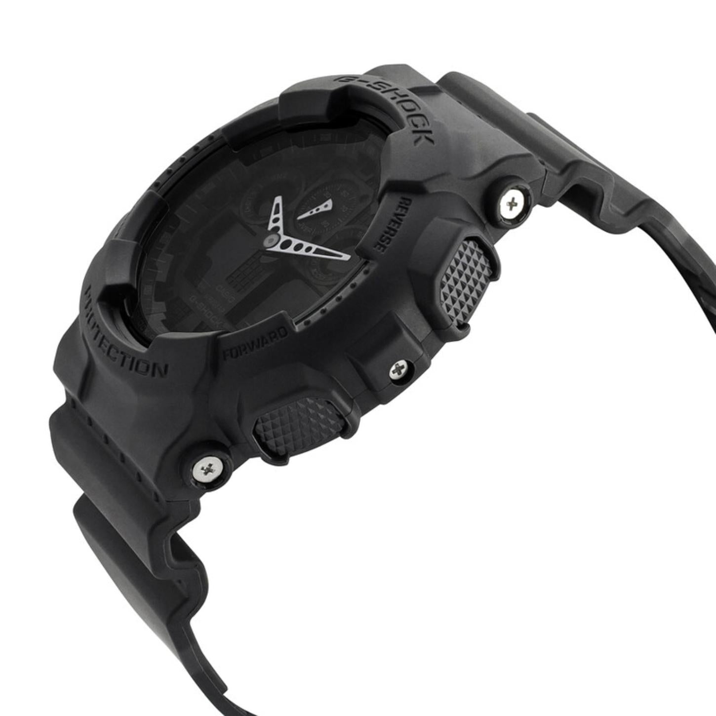 Side profile of the Casio G-Shock GA-100-1A1 showing the oversized shock-resistant resin case, textured buttons, protective bezel, and black resin strap.