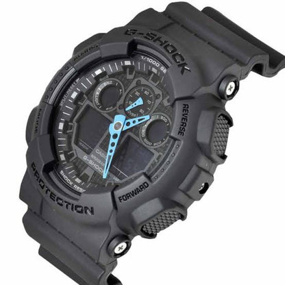 Angled view of the Casio G-Shock GA-100C-8A showing the gray shock-resistant resin case, blue hands, dark analog-digital dial, textured buttons, and protective bezel.