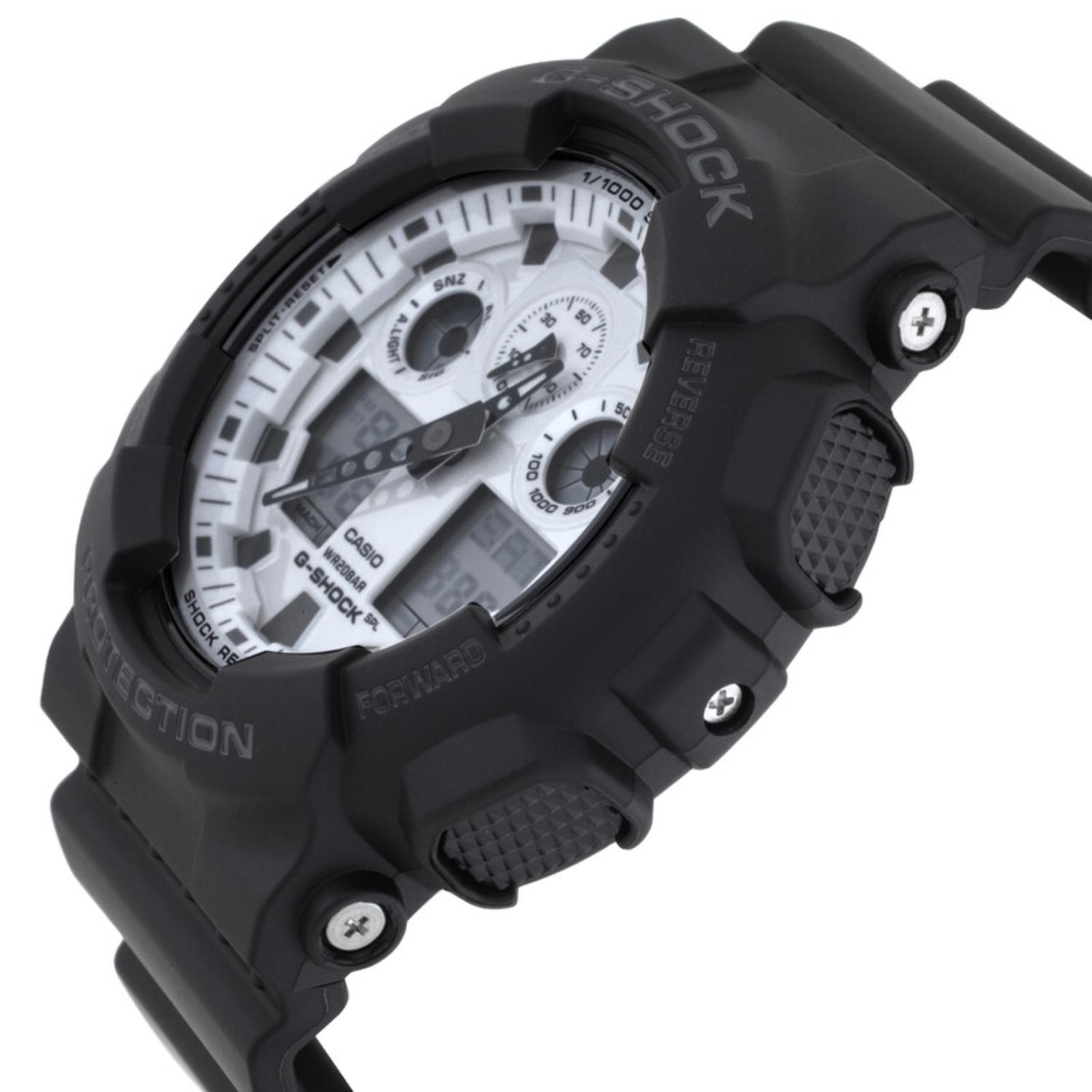 Casio G-Shock GA-100WD-1A from a side angle with a white analog-digital dial, black resin case, textured push buttons, and exposed metal accents.