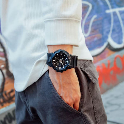 Casio G-Shock GA-700-1BCR men's ana-digi sport watch worn on wrist with casual white long sleeve shirt