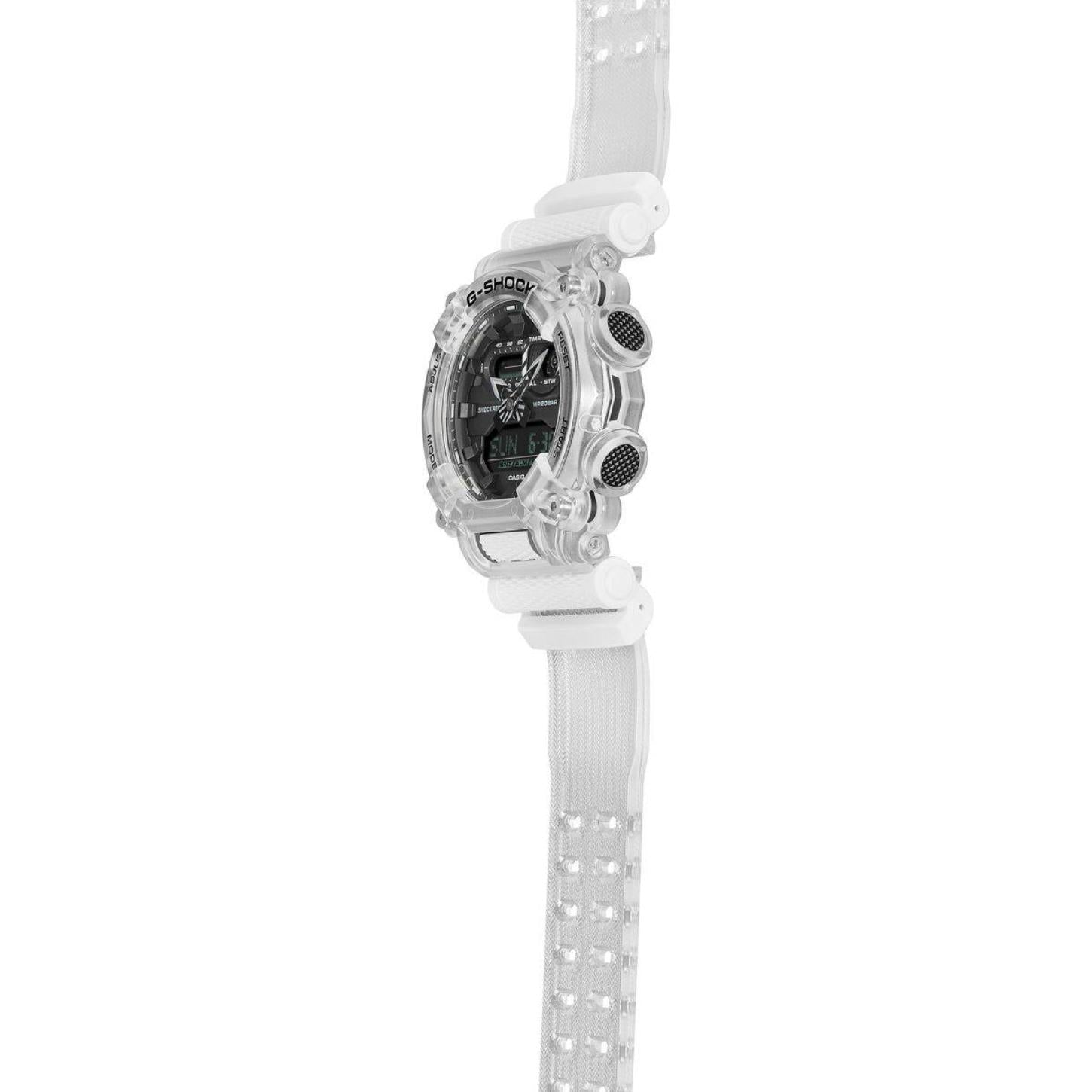 Angled profile of the Casio G-Shock GA-900SKL-7ADR showing the transparent resin case, black analog-digital dial, textured side buttons, and full transparent resin strap.