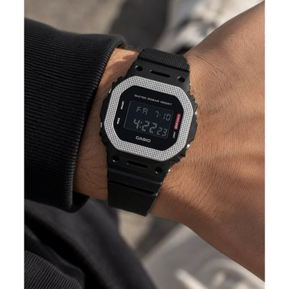 Casio G-Shock GM-5600BM-1 digital watch featuring a textured metal bezel and black resin strap worn on wrist
