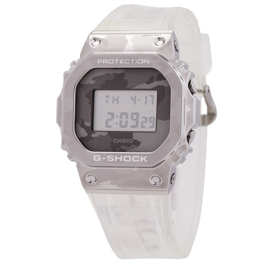 Front three-quarter view of the Casio G-Shock GM-5600SCM-1 digital watch showcasing its iconic square metal bezel and camouflage dial.
