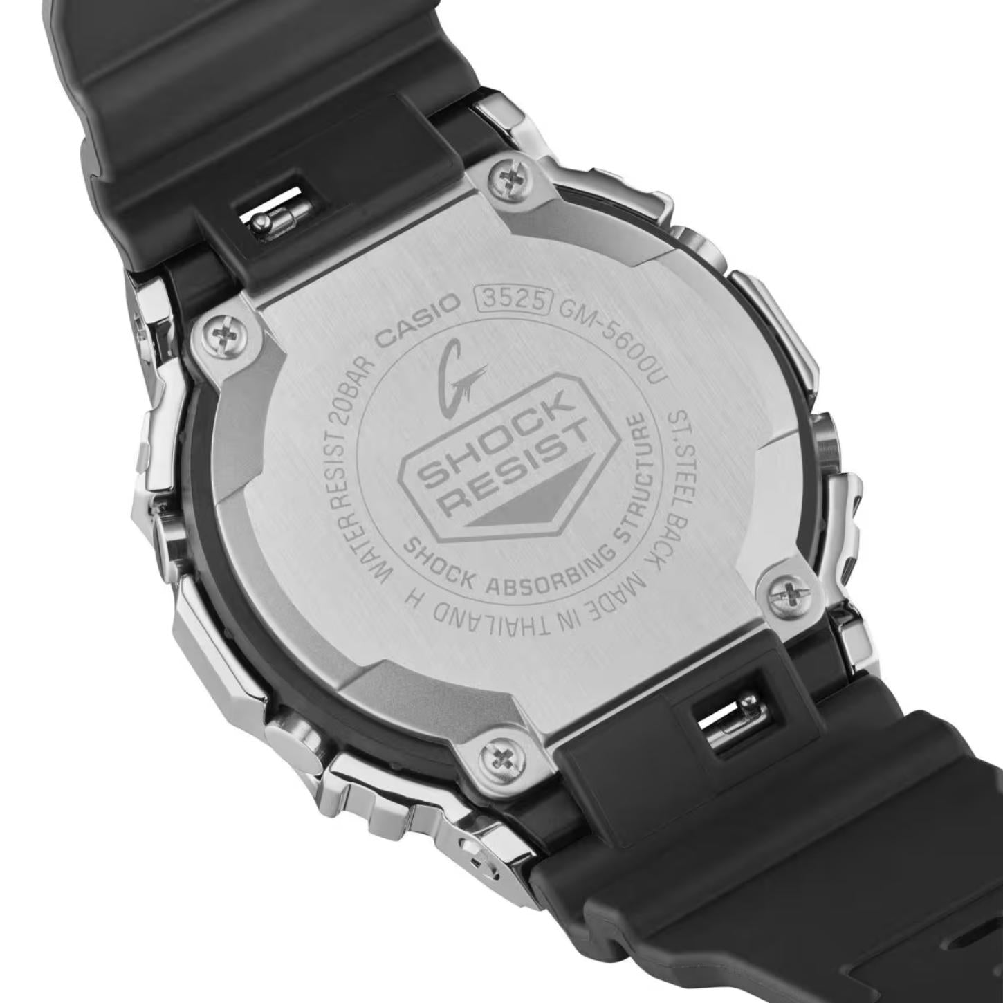 Casio G-Shock GM-5600U-1 from the back with an engraved stainless steel caseback, exposed screws, and black resin band.
