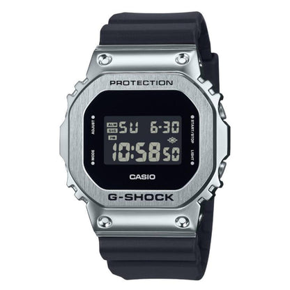 Casio G-Shock GM-5600U-1 with a rectangular digital display, brushed stainless steel bezel, and black resin band.