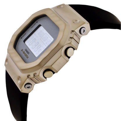 Casio G-Shock GM-S5600BC-1 women’s digital watch with a gold-tone side profile, exposed push buttons, visible screws, and a contrasting black strap.