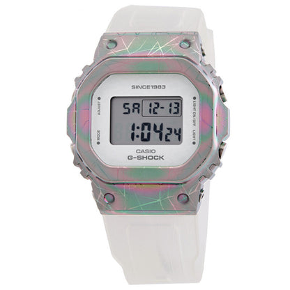 Casio G-Shock GM-S5640GEM-7DR women’s digital watch with a square digital display, iridescent rainbow-tone bezel with geometric patterning, and a translucent white strap.