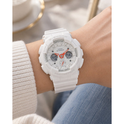 Casio G-Shock GMA-S120SA-7A1DR women's ana-digi sport watch worn on a wrist, featuring a white resin case, matching white dial, and bold orange hands.