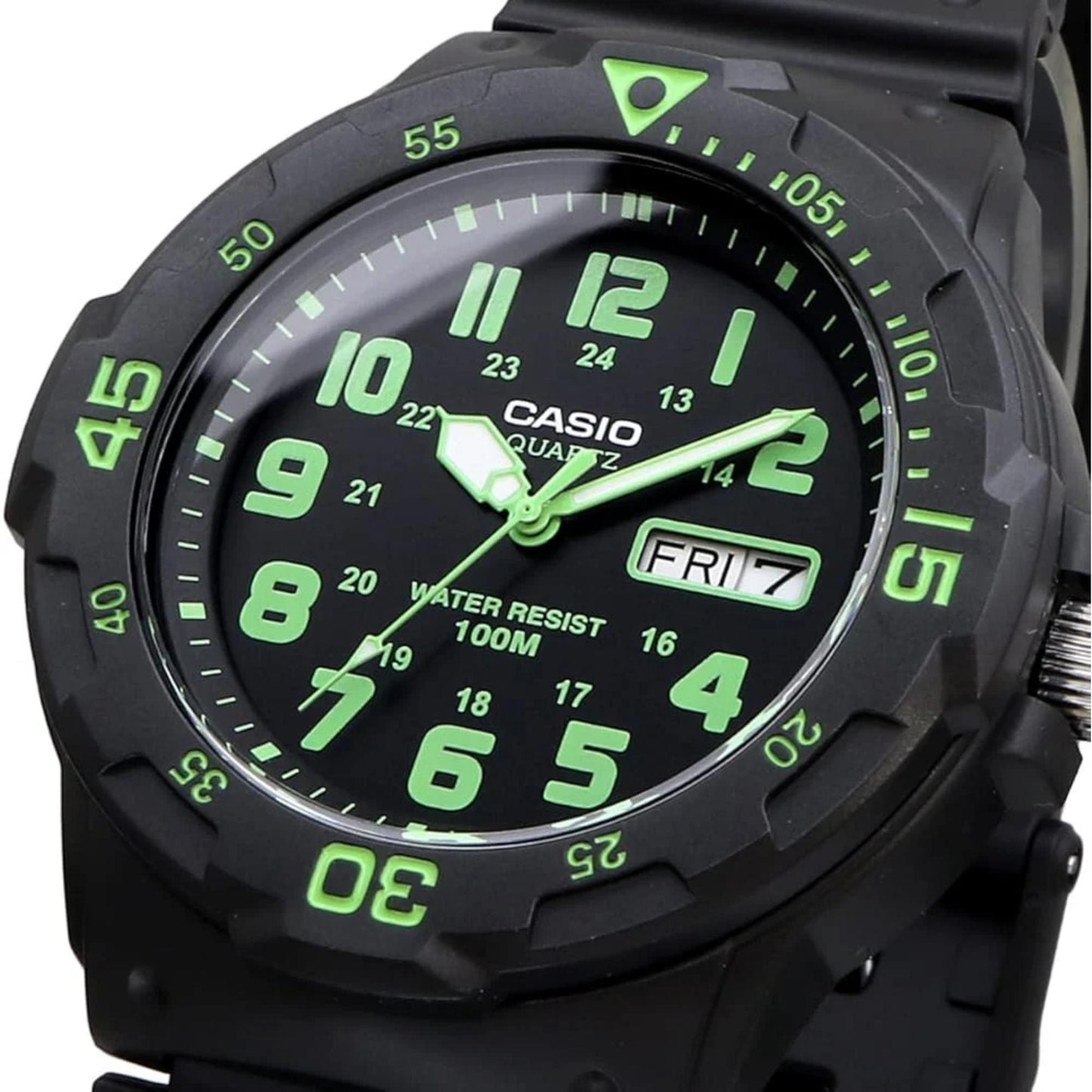 Casio MRW200H-3BV dive style sport watch close-up with black dial, green numerals, day-date display and black rotating bezel.