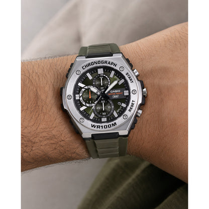 Casio MWA-300H-3A men’s chronograph watch with a green dial, silver-tone bezel, three subdials, and dark green strap worn on the wrist.