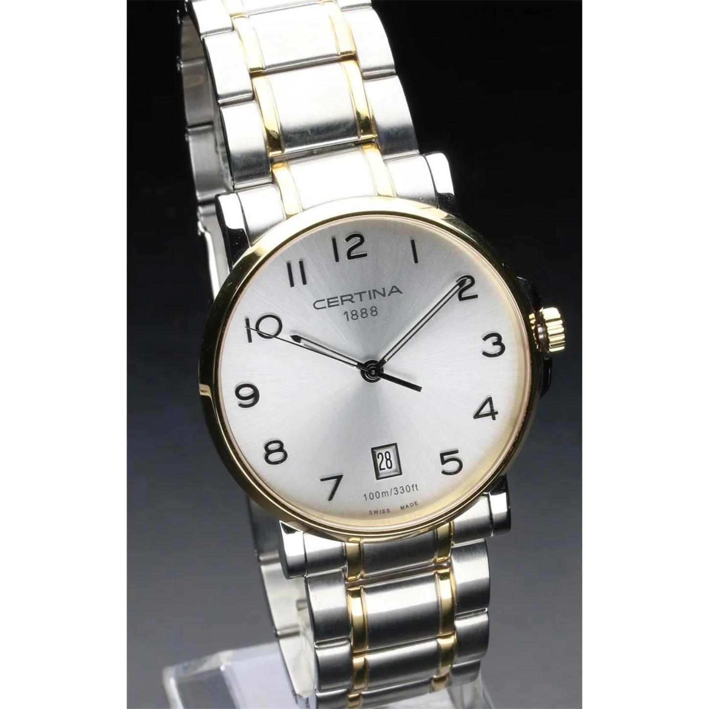 Certina C017.410.22.032.00 mens dress watch with silver dial, gold tone bezel and two tone stainless steel bracelet displayed on stand with classic design