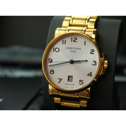 Certina C017.410.33.032.00 quartz dress watch with white dial, Arabic numerals, gold-tone stainless steel case and bracelet shown in close-up.