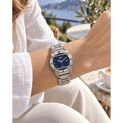 Certina DS Cascadeur women's quartz watch featuring a striking blue dial and stainless steel bracelet, worn on a wrist outdoors.
