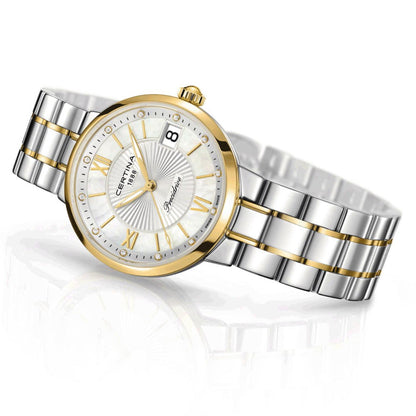 Certina DS Stella C031.210.22.116.00 en vista frontal inclinada, con esfera de nácar, índices con diamantes, números romanos dorados, fecha a las 3 y brazalete bicolor en acero y PVD dorado.