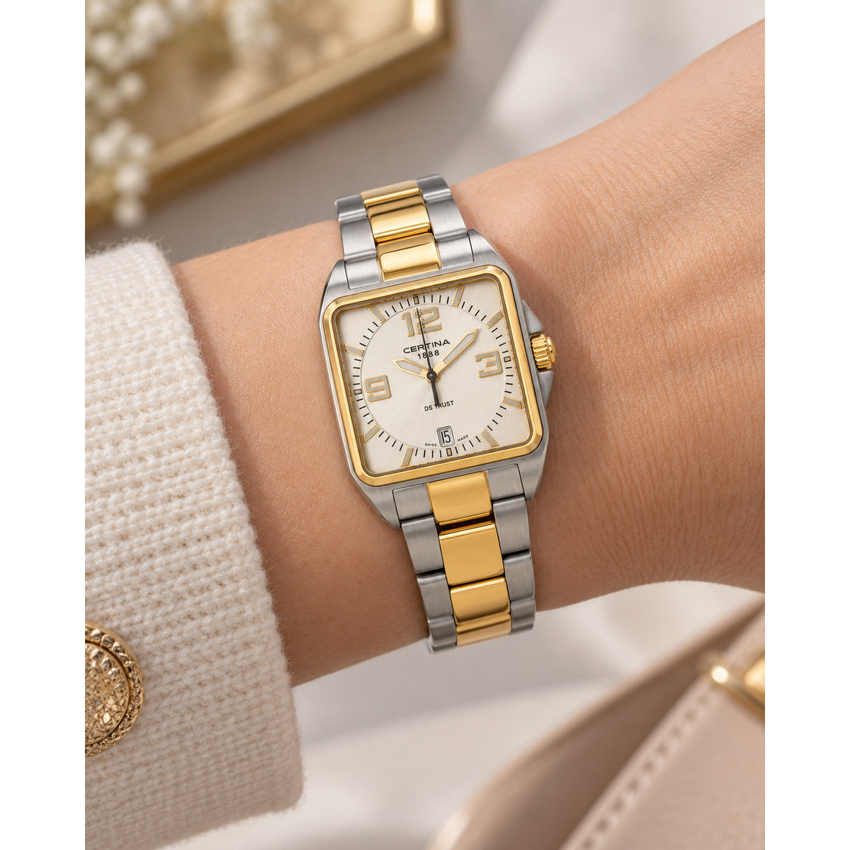 Certina DS Trust women's watch featuring a silver dial and two-tone steel and gold-plated bracelet worn on a wrist.