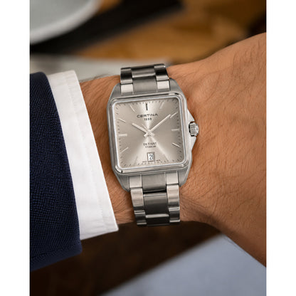 Certina DS Trust C019.510.44.081.00 with a silver dial, square titanium case, date window, and matching titanium bracelet worn on the wrist.