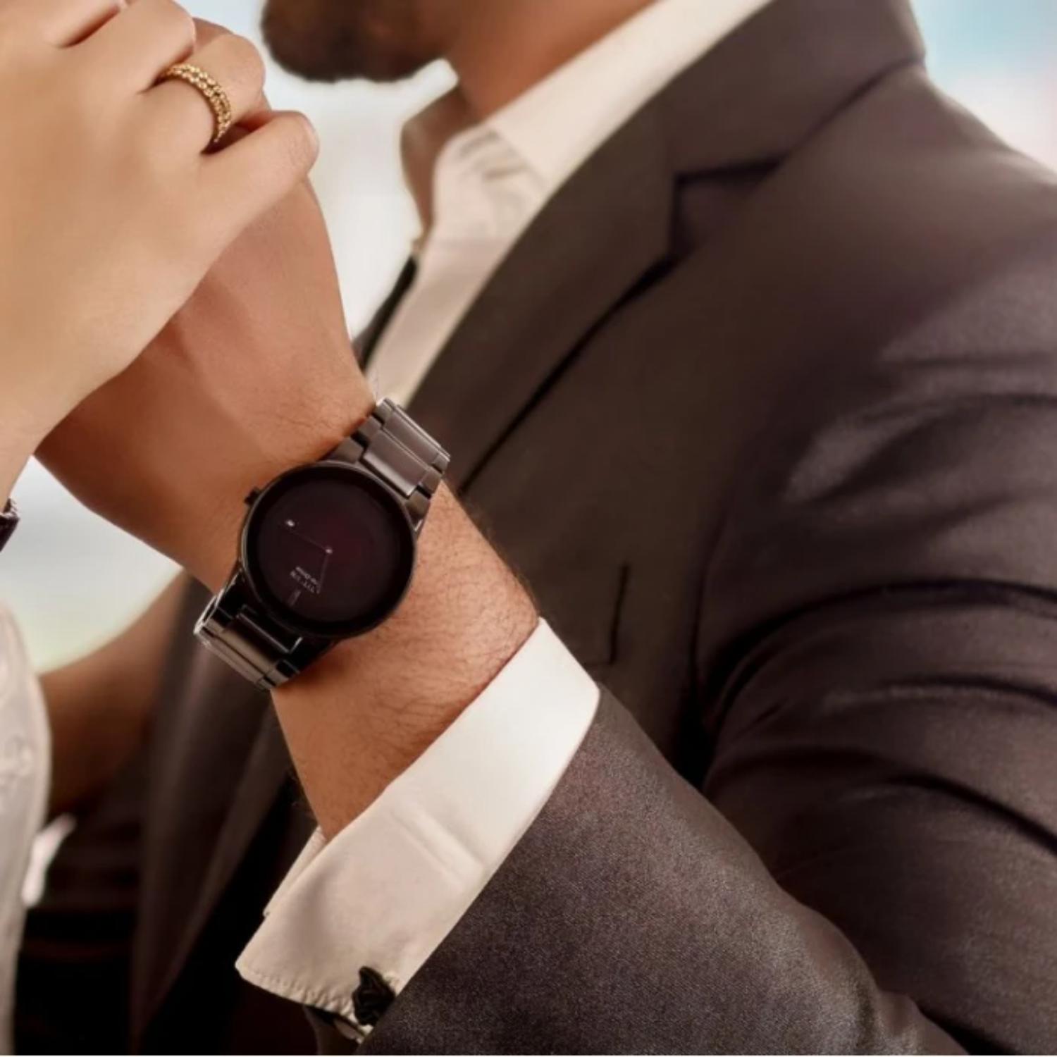 Citizen AU1065-58E mens dress watch with black minimalist dial and black bracelet worn with suit in elegant formal setting