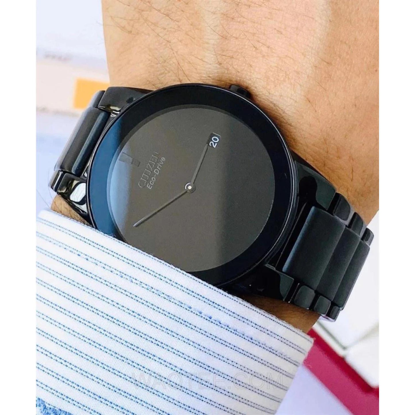 Citizen AU1065-58E mens watch on wrist with black minimalist dial, black stainless steel bracelet and sleek modern dress style