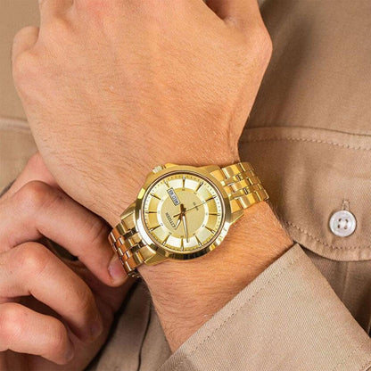 Citizen BF2013-56P worn on the wrist with gold dial, day and date display, gold-tone stainless steel case and gold-tone bracelet.